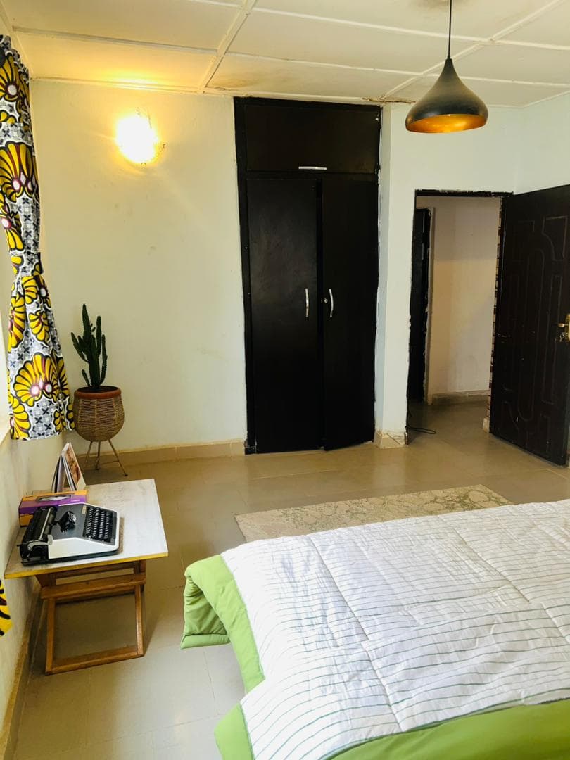 Bedroom with vintage typewriter and cactus